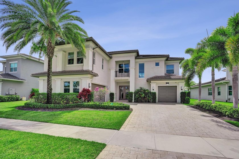 Discover elevated Florida living in this exceptional 5-bedroom - photo 6