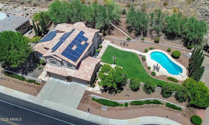 Tucked away on nearly 3/4 of an acre in the prestigious - photo 2
