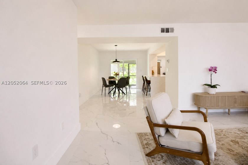 Welcome to this beautifully renovated first-floor condo in the - photo 2