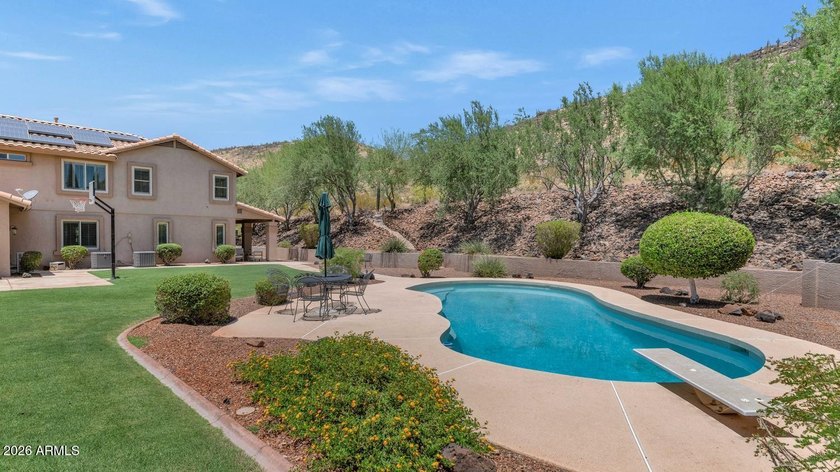Tucked away on nearly 3/4 of an acre in the prestigious - photo 3