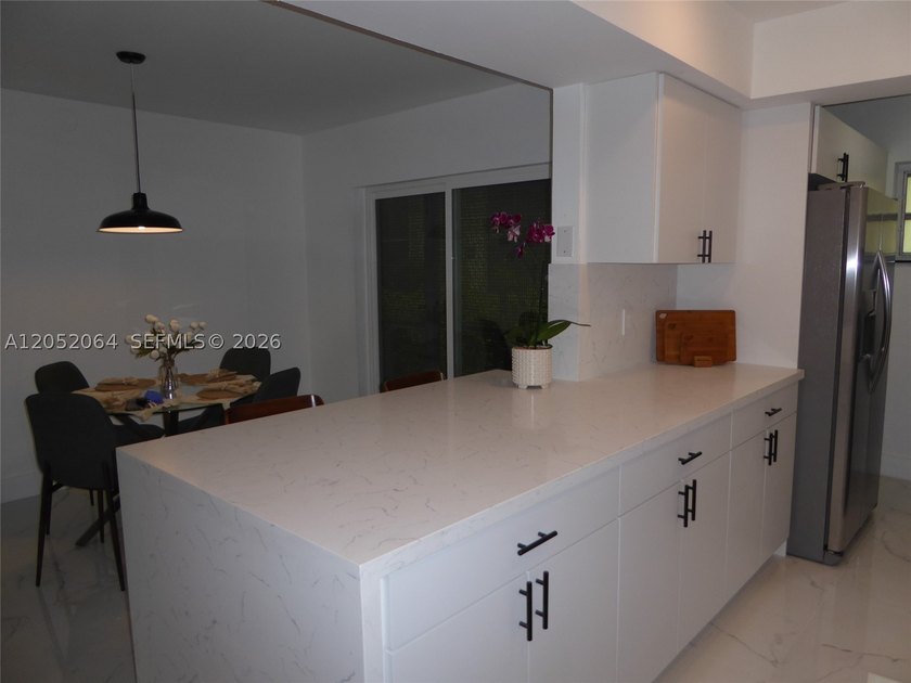 Welcome to this beautifully renovated first-floor condo in the - photo 4