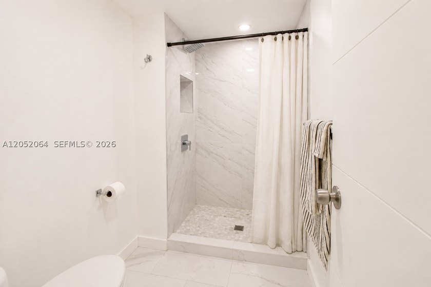 Welcome to this beautifully renovated first-floor condo in the - photo 10