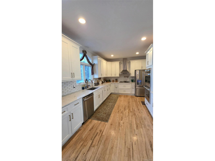 WATERFRONT Luxury Living in highly desired West Islip at an - photo 12