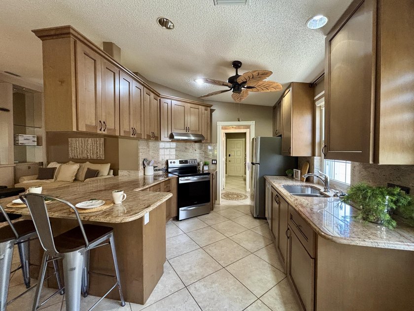 Lakefront living in the heart of St. Lucie West! This spacious - photo 8