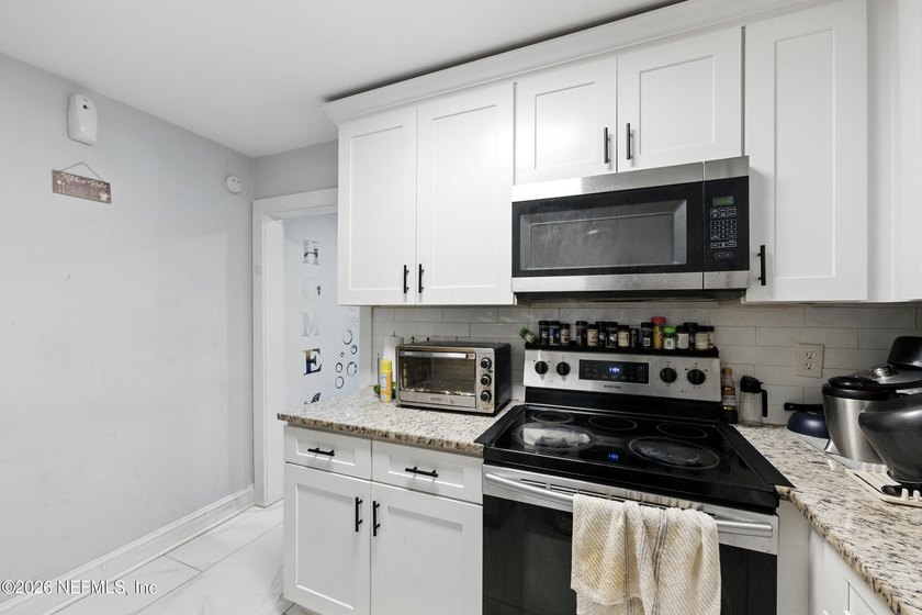 HUGE PRICE IMPROVEMENT on this 4-bedroom, 2-bath home is full of - photo 13