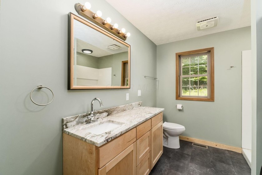**Agent Owned** Taken down to the studs and rebuilt. This 3-bed - photo 29