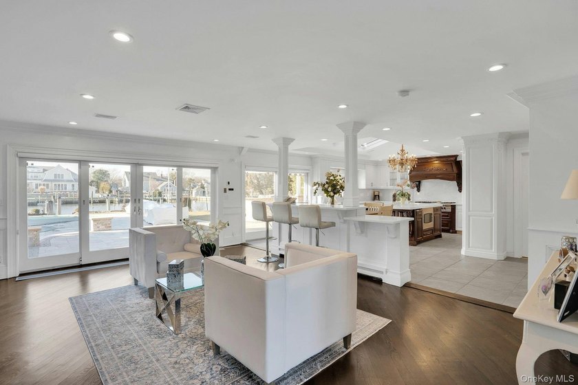 Privately gated, prestigious waterfront home in the heart of - photo 11