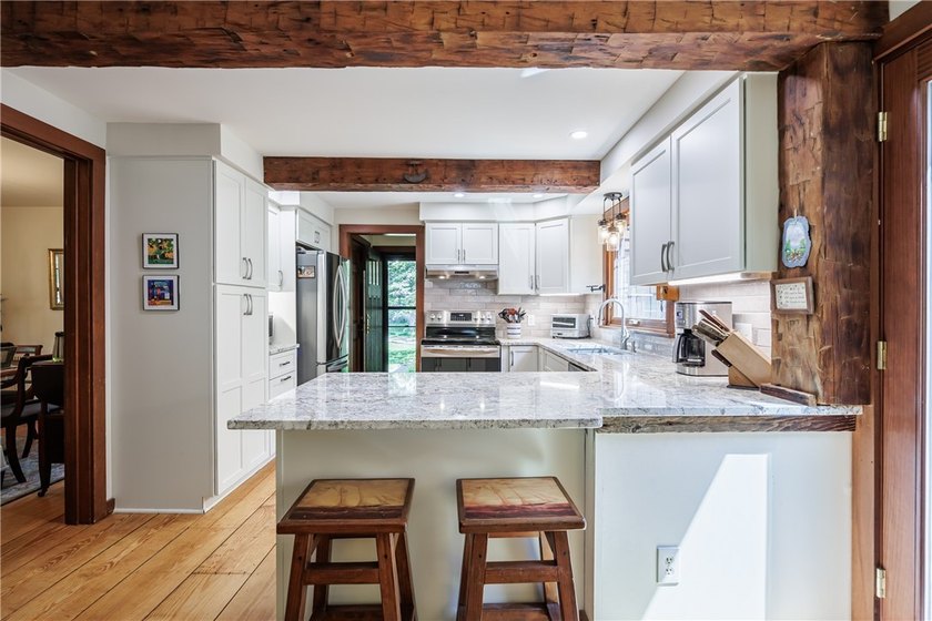 Welcome to 87 Loch Revan Heights. This four bedroom, one and a - photo 13