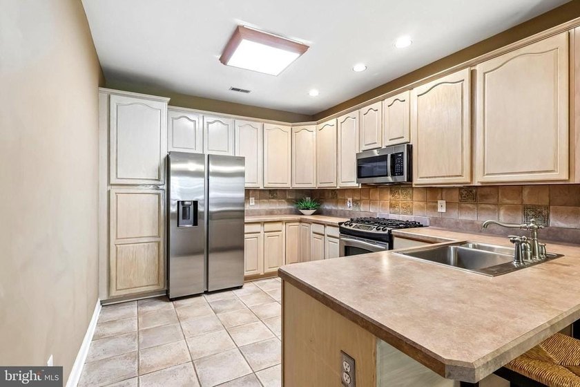 Experience low-maintenance luxury living in this beautifully - photo 18
