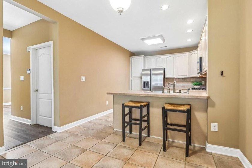 Experience low-maintenance luxury living in this beautifully - photo 19