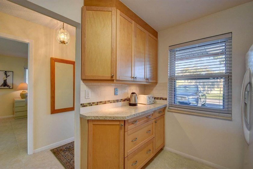 This beautifully renovated corner villa offers a perfect blend - photo 13