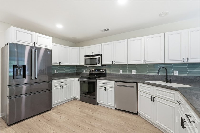 This modern, updated home on Whitemarsh Island is a true - photo 14