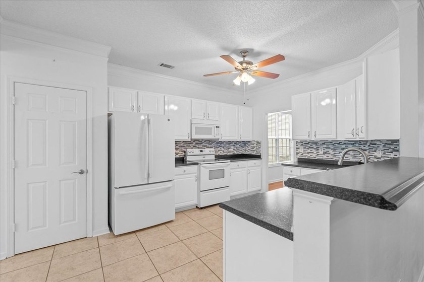 WELCOME TO LOW-MAINTENANCE LIVING... WITHOUT SACRIFICING THE - photo 10