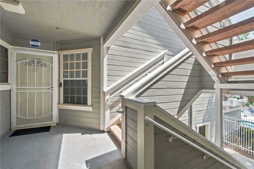 Tucked inside the gated Chelsea Court community in the heart of - photo 3