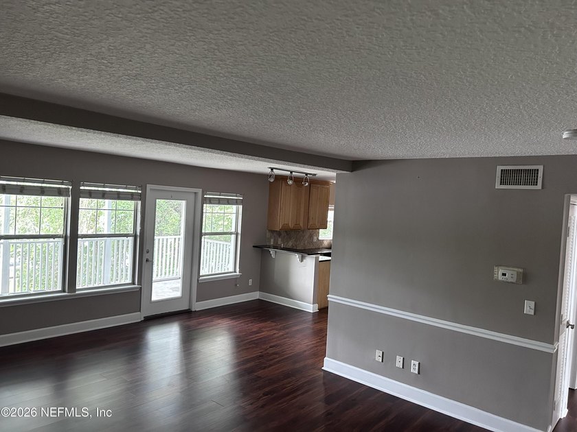 This 950-square-foot, two-bedroom, two-bath end unit sits in the - photo 2