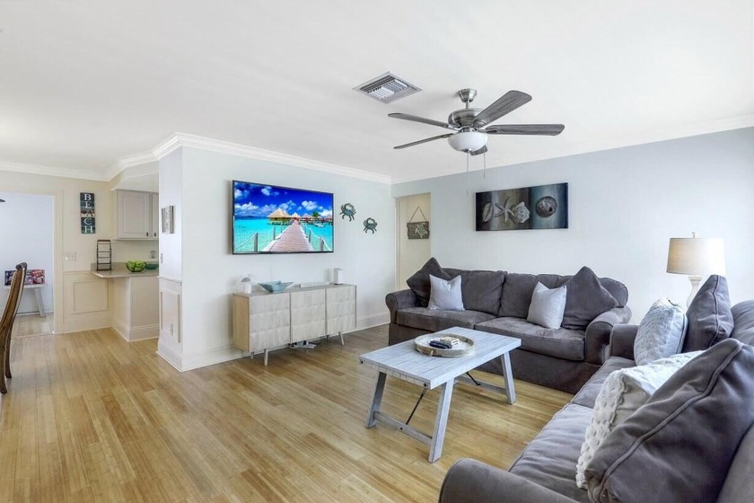 Step into this beautifully updated 3-bedroom island retreat on - photo 2