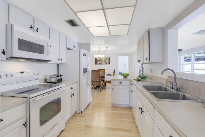 Step into this beautifully updated 3-bedroom island retreat on - photo 7
