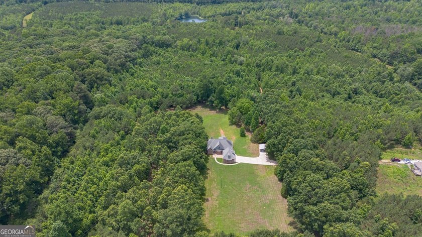 Set well back from the road and surrounded by 36 private acres - photo 2