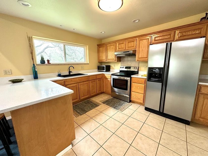 Tucked away on 2 private, oak-studded acres, this peaceful - photo 16