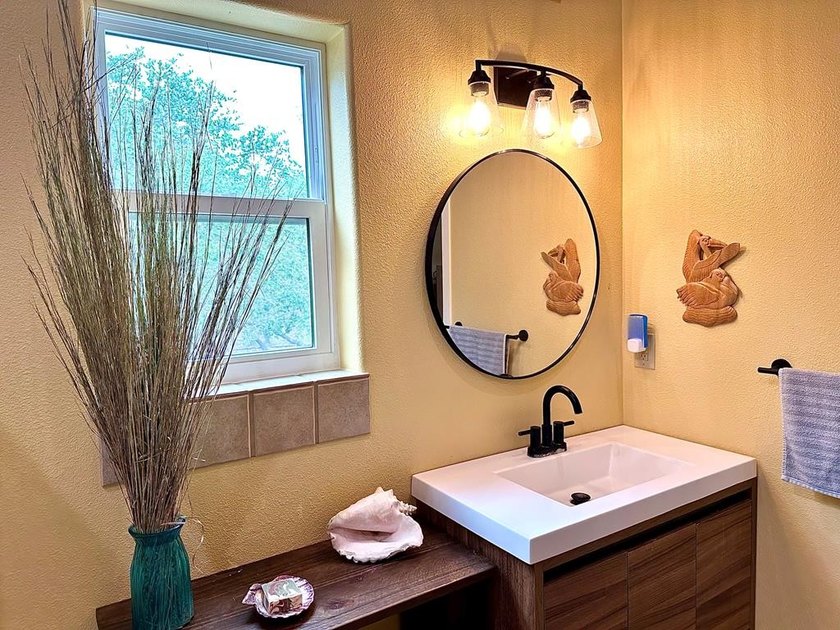 Tucked away on 2 private, oak-studded acres, this peaceful - photo 20
