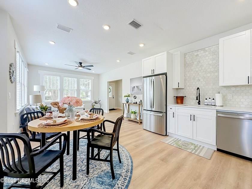 Timeless Riverside charm meets modern luxury in this beautifully - photo 8