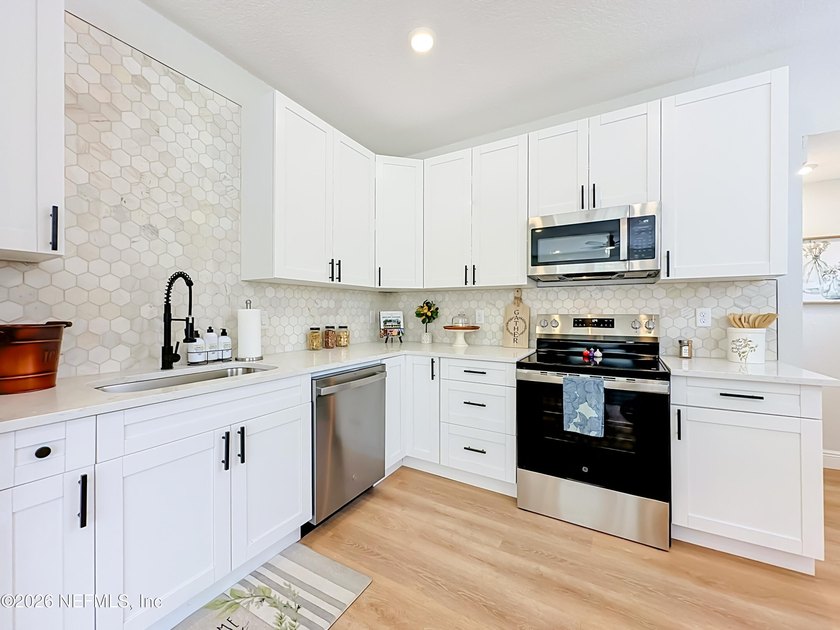 Timeless Riverside charm meets modern luxury in this beautifully - photo 9