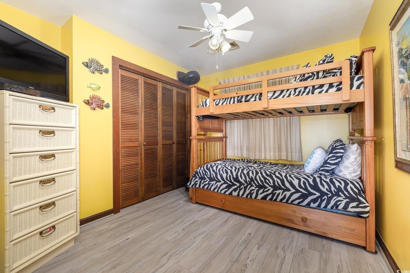 Welcome to this charming two-bedroom, two-bathroom end-unit - photo 19