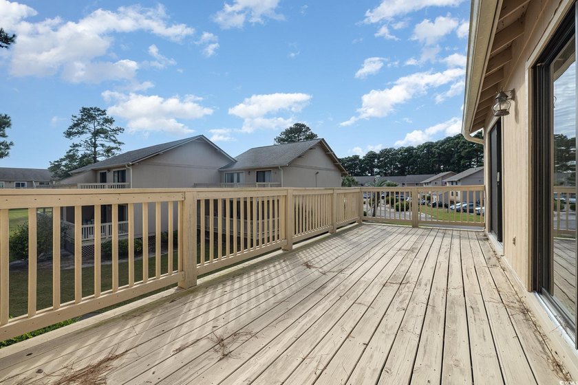 Welcome to this charming two-bedroom, two-bathroom end-unit - photo 28