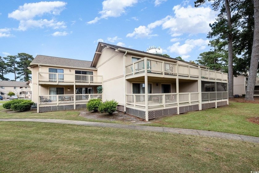 Welcome to this charming two-bedroom, two-bathroom end-unit - photo 33