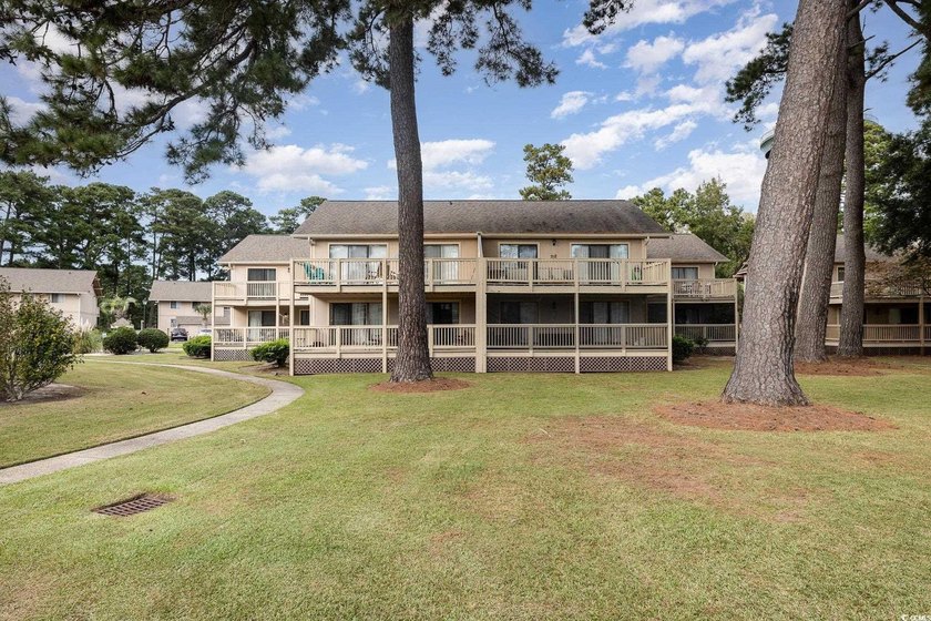 Welcome to this charming two-bedroom, two-bathroom end-unit - photo 34