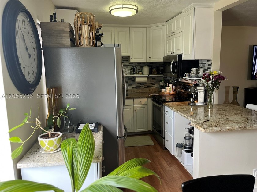 Beautifully renovated corner 2-bedroom, 2-bath residence located - photo 11