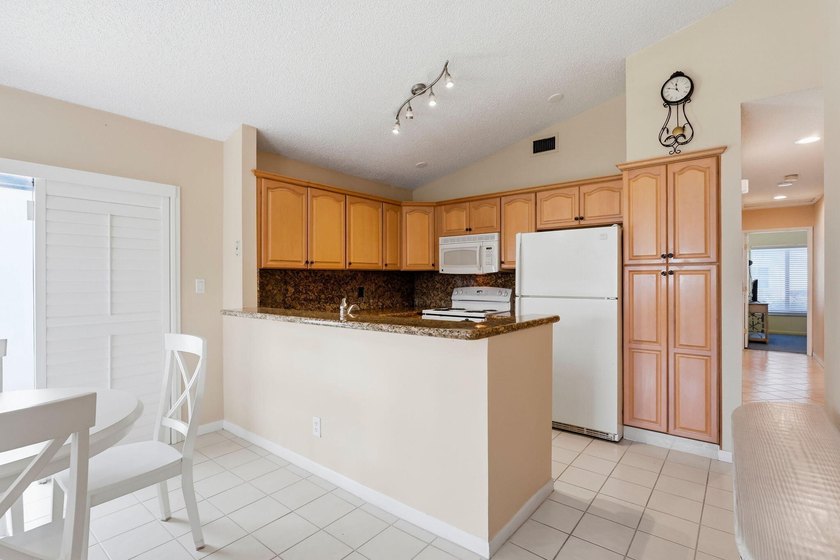 Welcome to this exceptional single-story waterfront residence - photo 10