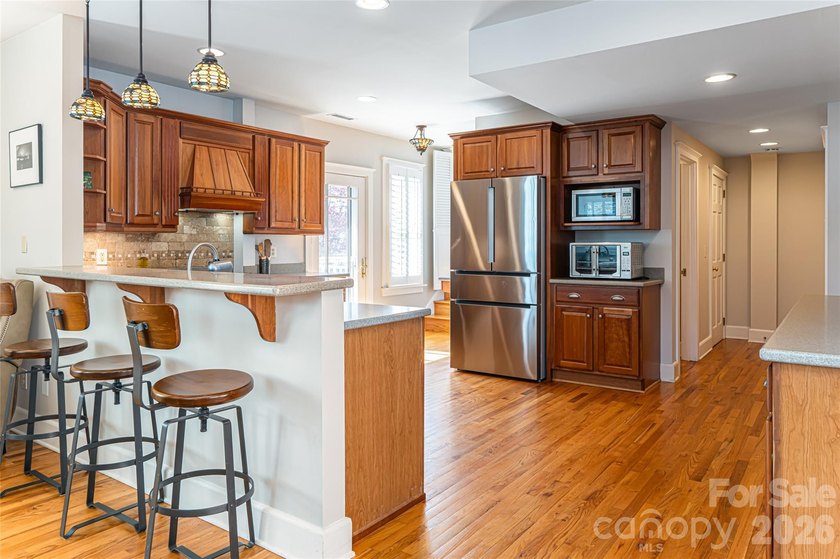 There is a warm, inviting grace to this Grove Park home that - photo 8