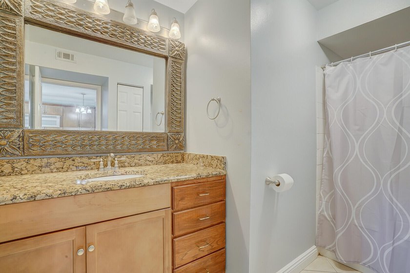 Welcome to this inviting first-floor condo in a gated community - photo 14
