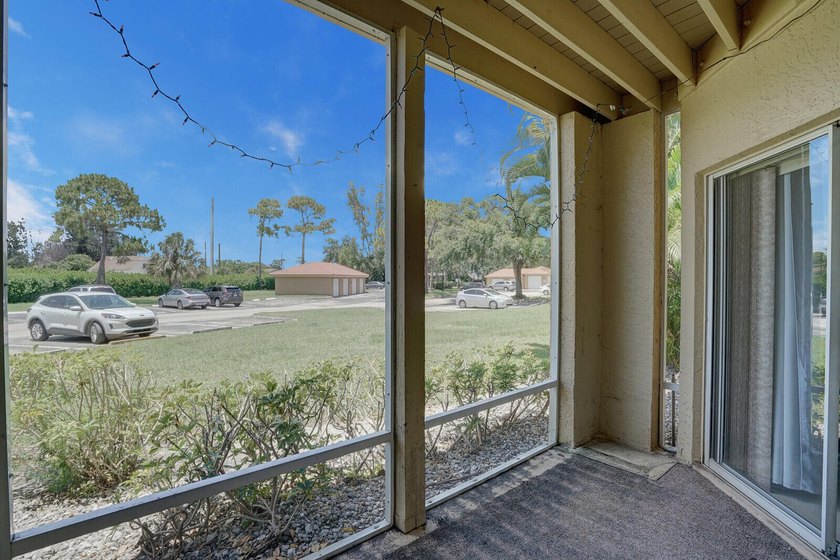Welcome to this inviting first-floor condo in a gated community - photo 18