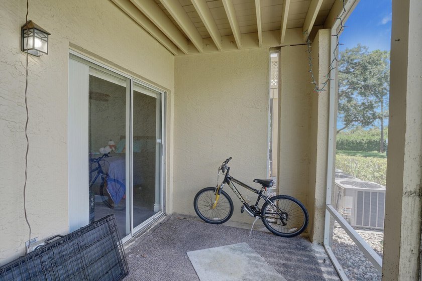 Welcome to this inviting first-floor condo in a gated community - photo 19