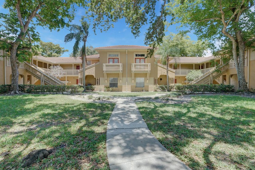 Welcome to this inviting first-floor condo in a gated community - photo 24