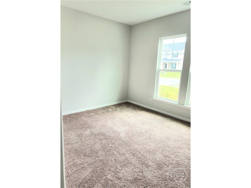 Like New! This 3-bedroom, 2-bath home features valuable upgrades - photo 5