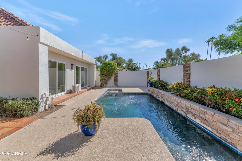 Located in a prestigious gated community at the world-renowned - photo 2