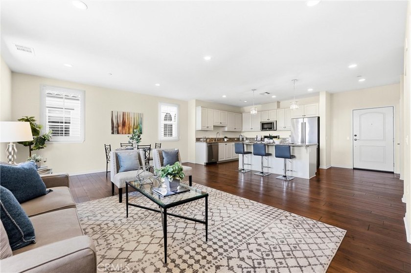 Introducing a stunning top-floor, single-story residence in the - photo 3