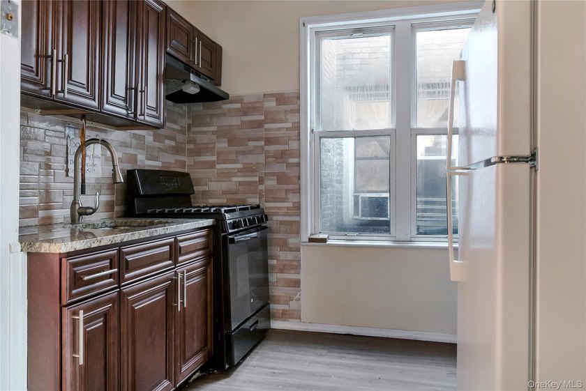New to the market, this move-in ready two-family Brick property - photo 13