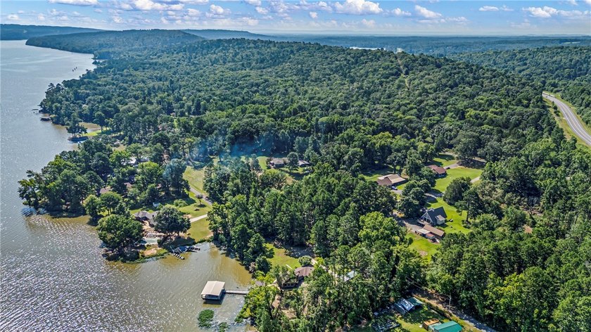 Tucked away along the shoreline of Lake Dardanelle, this - photo 50