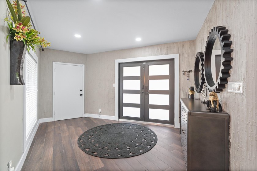Completely remodeled and designed for luxury living, this - photo 2