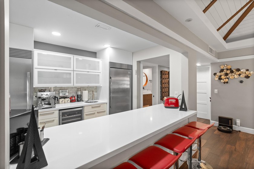 Completely remodeled and designed for luxury living, this - photo 7