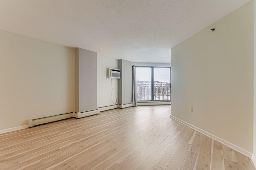 Welcome to Unit 401 at 6500 Woodlake Drive, an inviting - photo 6