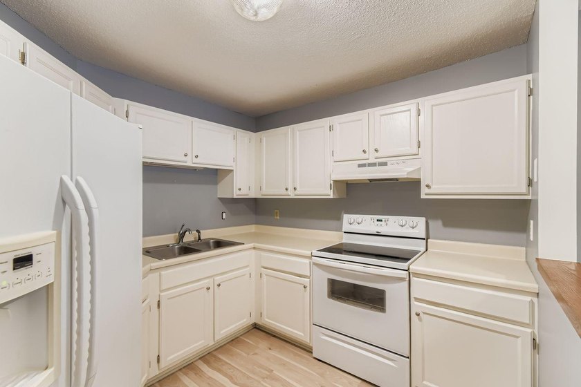 Welcome to Unit 401 at 6500 Woodlake Drive, an inviting - photo 10