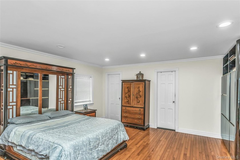 Set on a manicured corner lot in Bayside, this expanded Colonial - photo 14