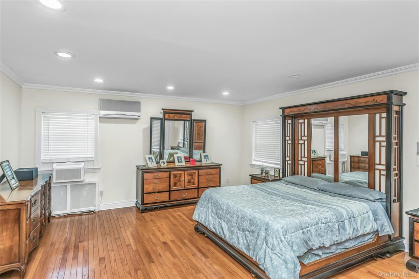 Set on a manicured corner lot in Bayside, this expanded Colonial - photo 15