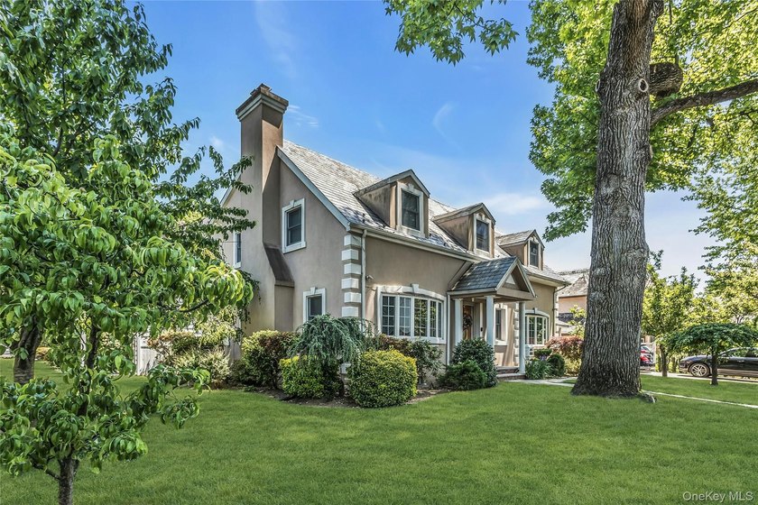 Set on a manicured corner lot in Bayside, this expanded Colonial - photo 29