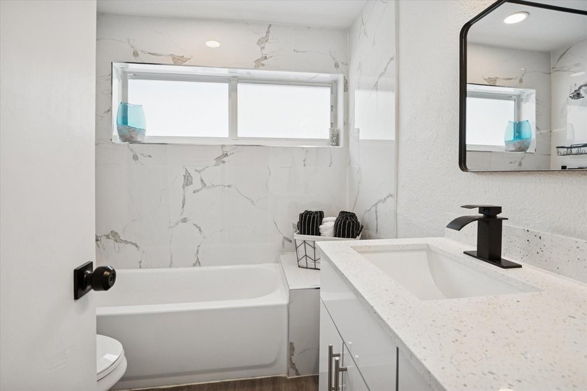 All remodeled with a new open kitchen and large impact sliders - photo 14